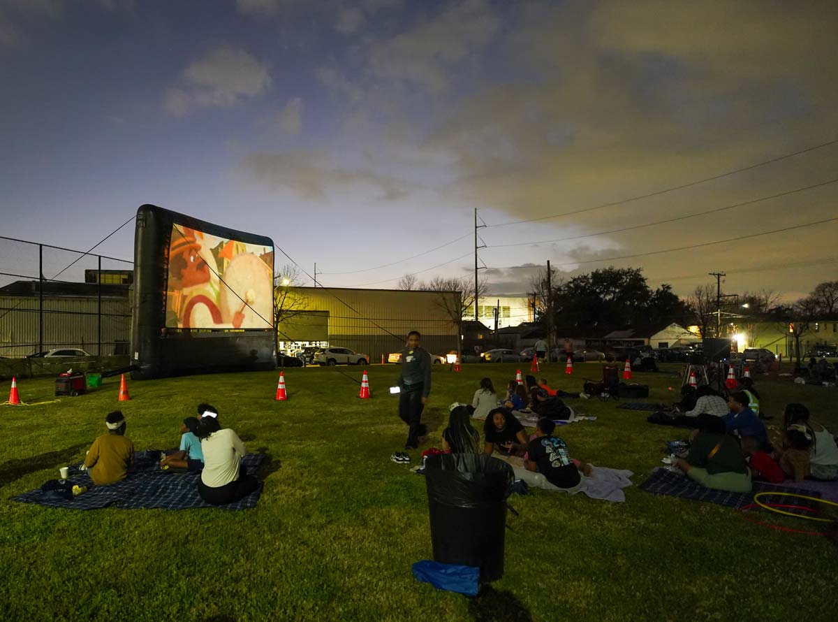 New Orleans residents picnicking at a NORD movies in the park event