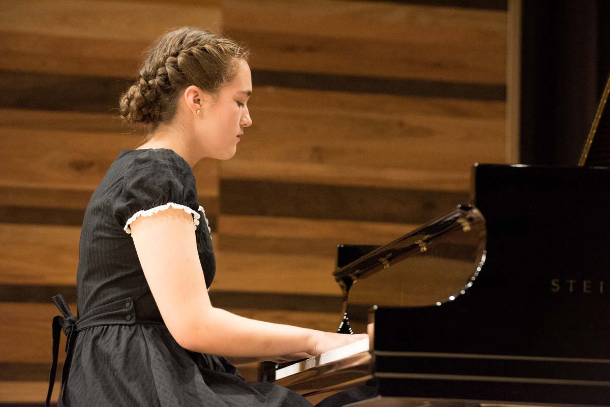 Youth playing piano at NORD